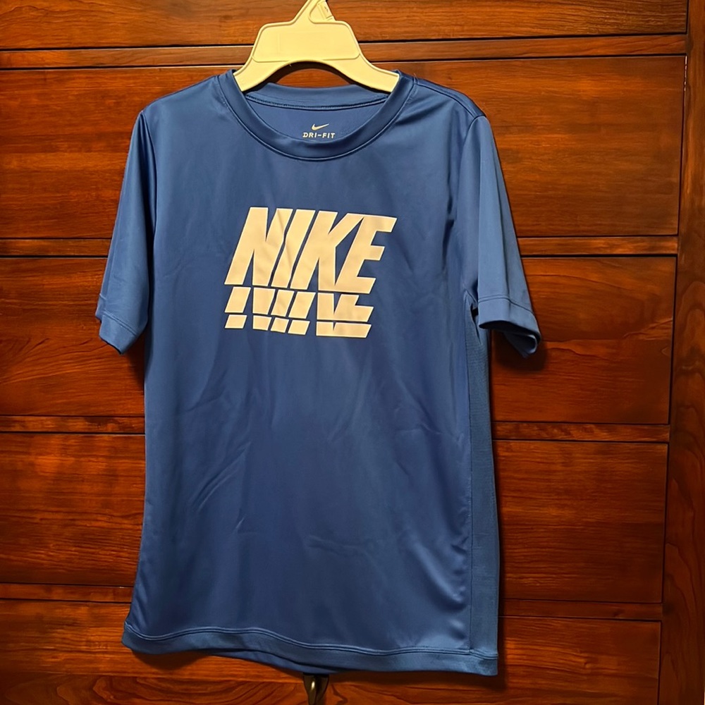 Blue shirt Nike Dri-Fit. Youth XL with Nike logo. Unused.